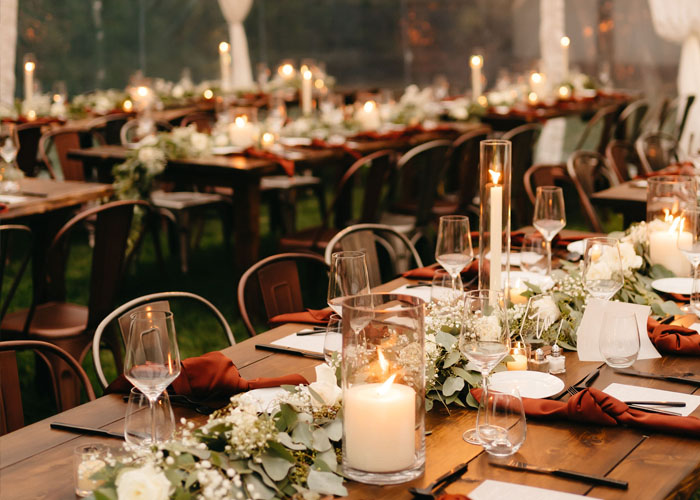 wedding tables set up under a wedding tent